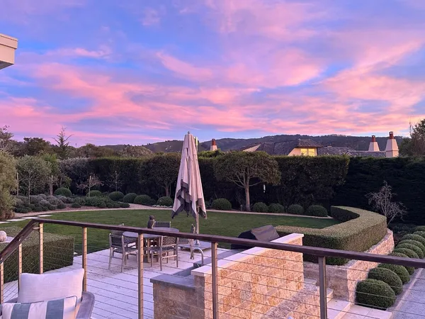 a view of a chairs and table in the patio