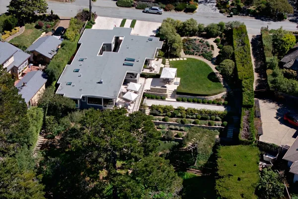 an aerial view of multiple houses with outdoor space