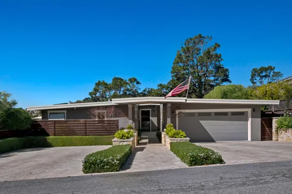 front view of a house with a small yard