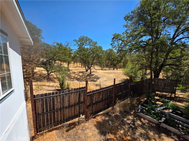 a view of a wooden fence