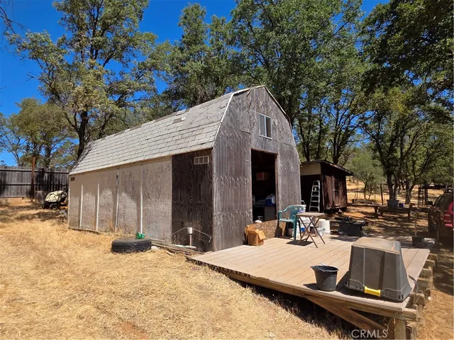 a view of a house with chairs and sitting area