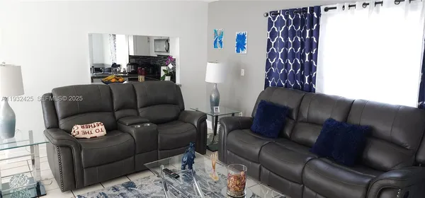 a living room with furniture and a window