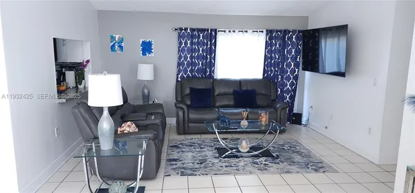 a living room with furniture and a window