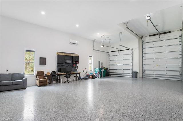 a view of a room with gym equipment and a large window