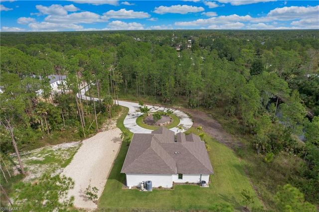 a view of a swimming pool with a yard