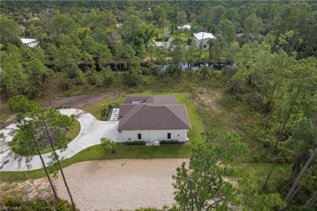 an aerial view of a house with a garden