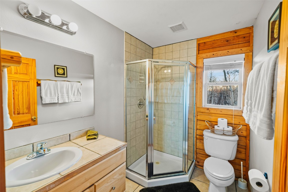 1026 Warpath Road Como, CO 80456 - Photo 18 of 45 a bathroom with a granite countertop sink toilet and shower