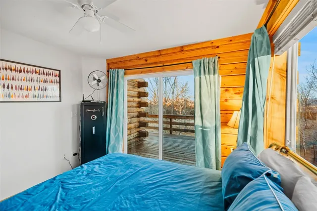 a bed room with a bed and a window