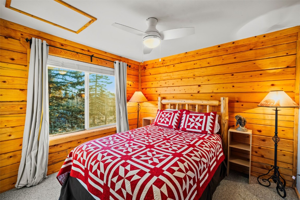 1026 Warpath Road Como, CO 80456 - Photo 21 of 45 a bedroom with a bed and a window
