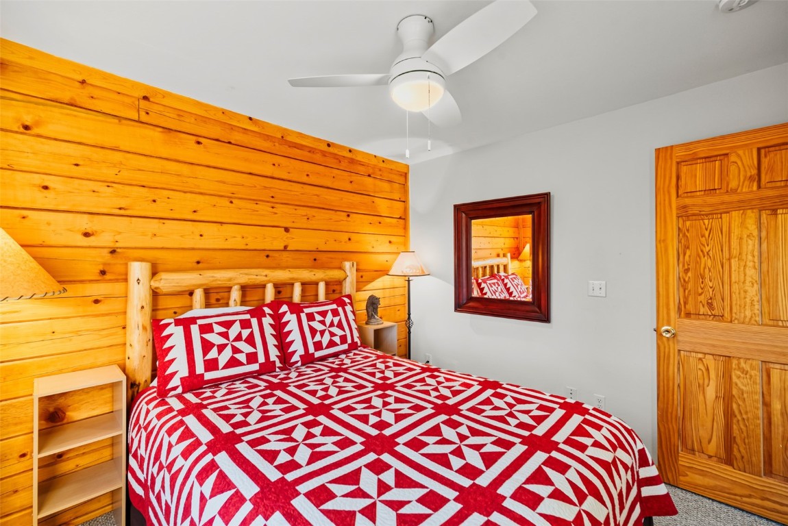 1026 Warpath Road Como, CO 80456 - Photo 22 of 45 a bedroom with a bed and a window