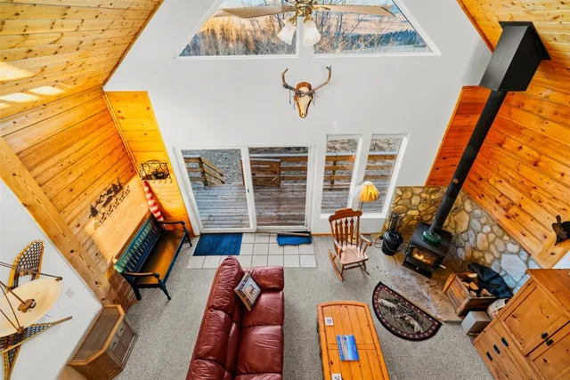 view of living room with furniture and a fireplace