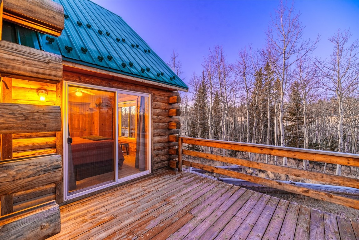 1026 Warpath Road Como, CO 80456 - Photo 42 of 45 a view of a balcony with wooden floor and outdoor space