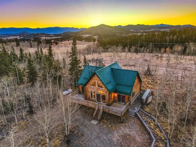 a living room with furniture and a yard