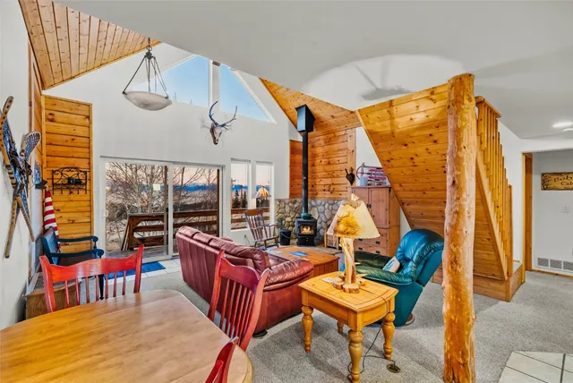 a bedroom with furniture and a wooden floor