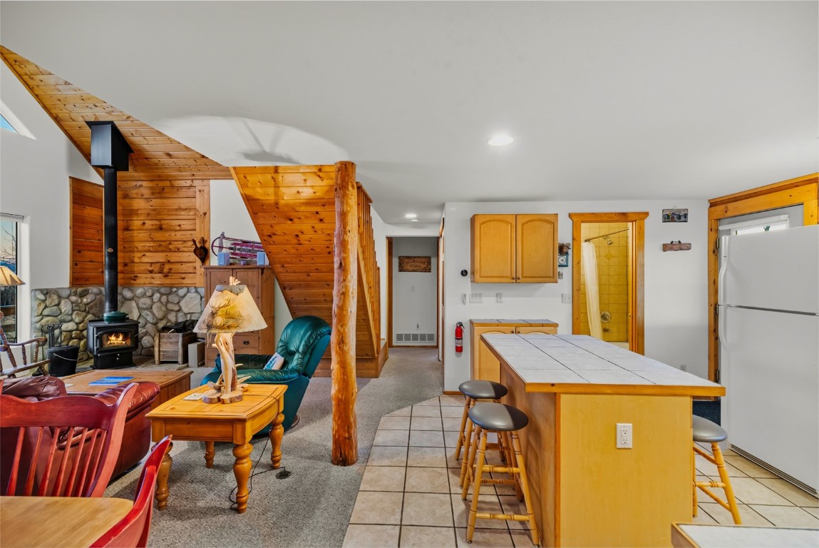 1026 Warpath Road Como, CO 80456 - Photo 8 of 45 a balcony with chairs and table with wooden floor