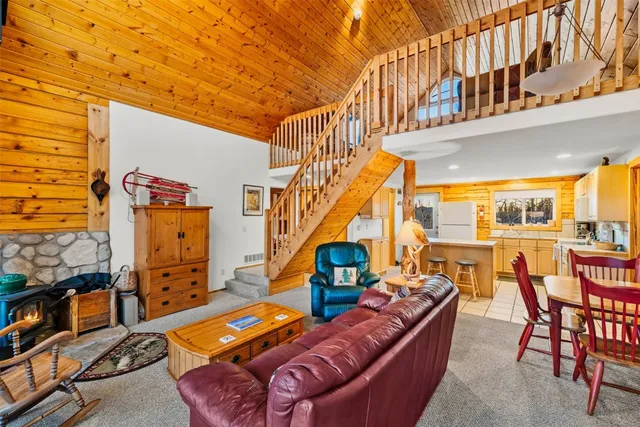 a view of a living room and balcony with furniture