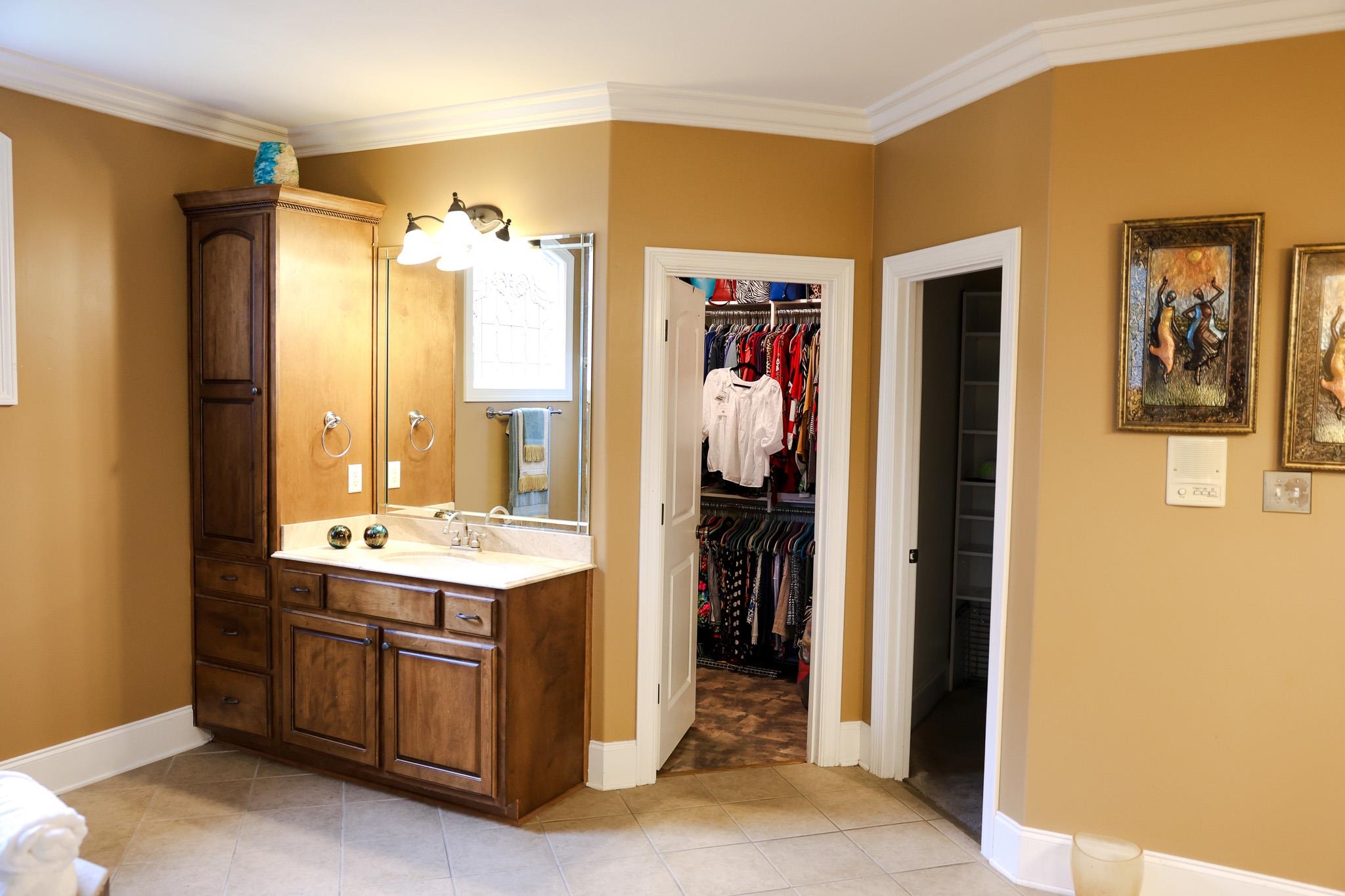 649 Ridge Springs Road Collierville, TN 38017 - Photo 22 of 35 Full bathroom featuring crown molding, vanity, a spacious closet, and light tile patterned floors