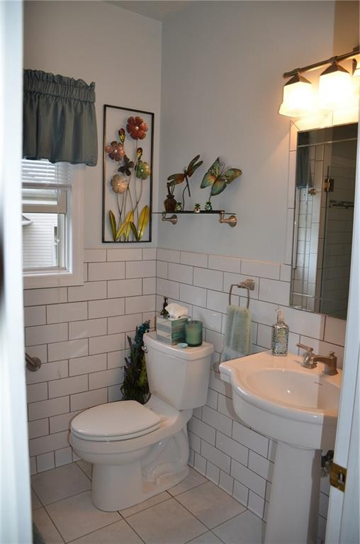 315 Quail Ridge Court Gibsonia, PA 15044 - Photo 13 of 25 The master bath features a tile floor, subway tiled wall and pedestal sink.