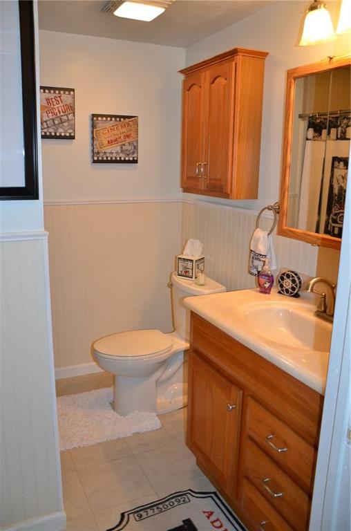315 Quail Ridge Court Gibsonia, PA 15044 - Photo 22 of 25 The lower level full bath has oak cabinetry, full shower and tile floor.