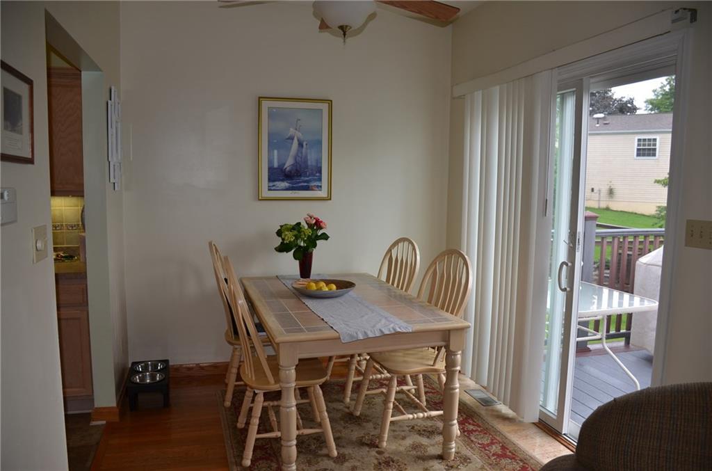 315 Quail Ridge Court Gibsonia, PA 15044 - Photo 7 of 25 The dining area also features hardwood floors, a ceiling fan and opens out to the rear deck.