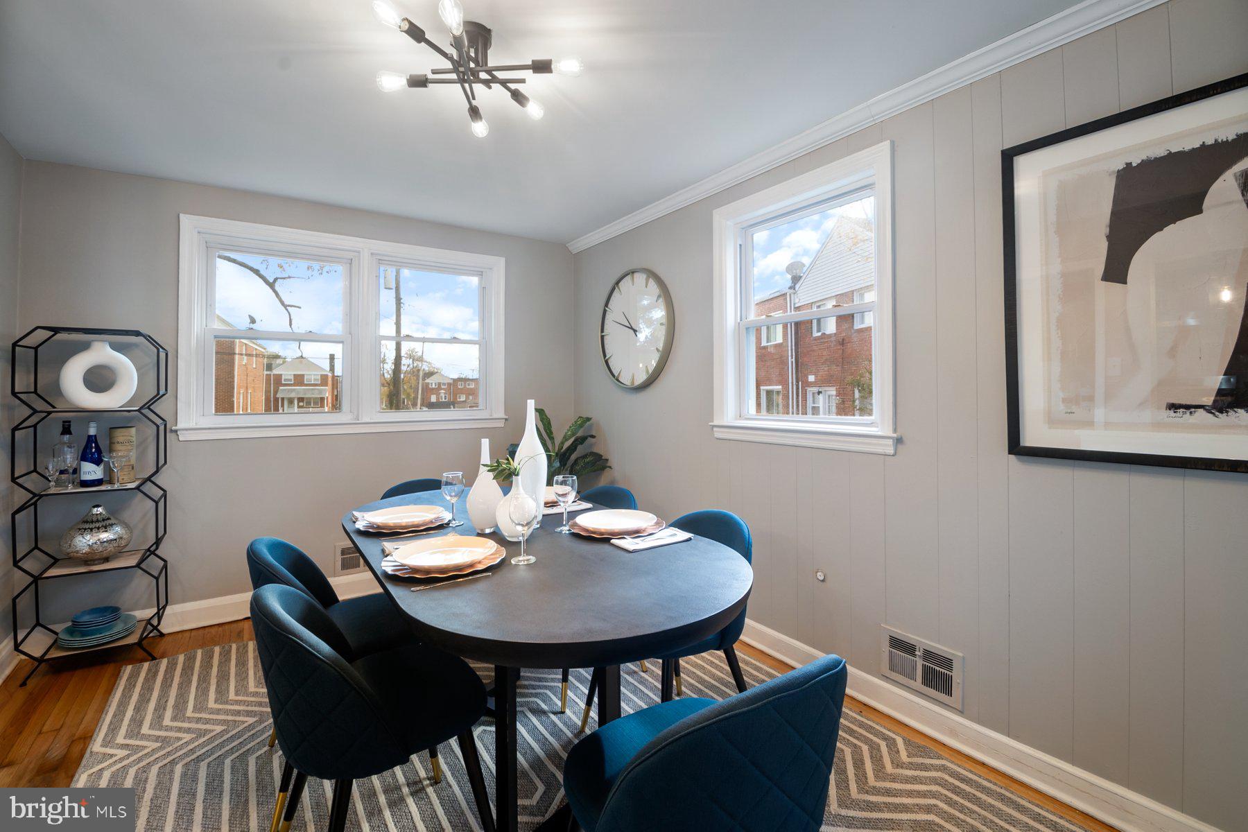 4801 Sinclair Lane Baltimore, MD 21206 - Photo 13 of 28 a view of a dining room with furniture and wooden floor