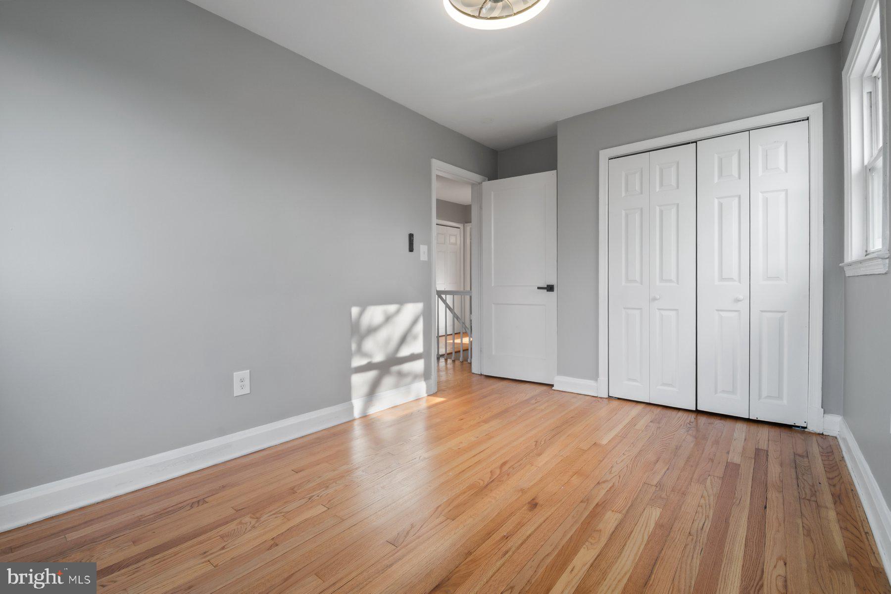 4801 Sinclair Lane Baltimore, MD 21206 - Photo 18 of 28 a view of an empty room and wooden floor