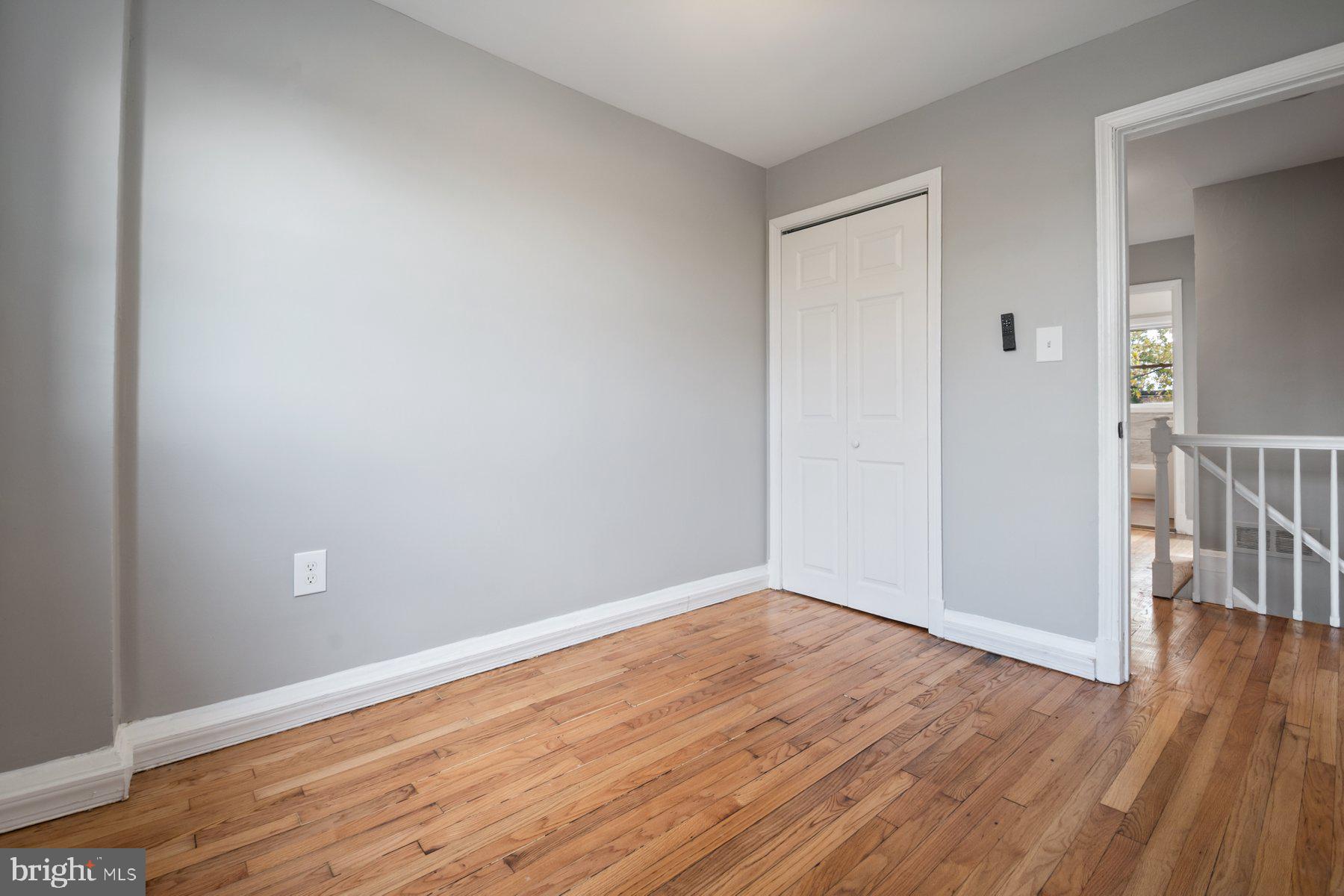 4801 Sinclair Lane Baltimore, MD 21206 - Photo 22 of 28 a view of an empty room with wooden floor