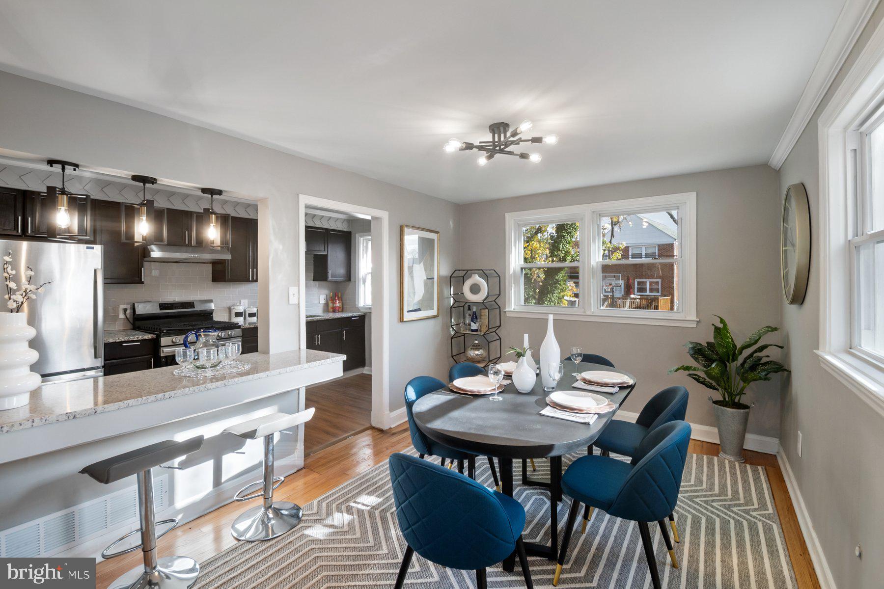 4801 Sinclair Lane Baltimore, MD 21206 - Photo 6 of 28 a view of a dining room with furniture window and wooden floor