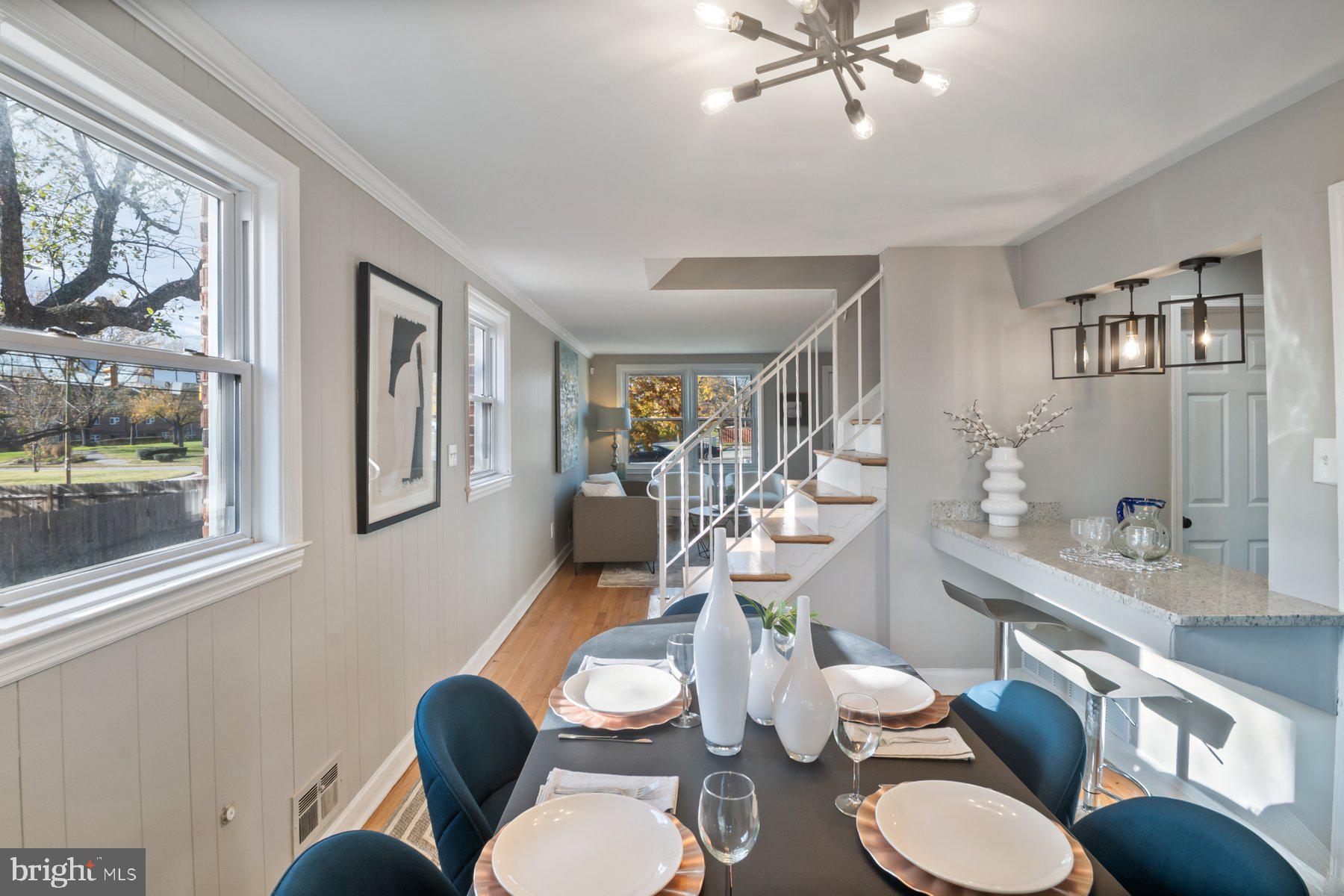 4801 Sinclair Lane Baltimore, MD 21206 - Photo 7 of 28 a room with furniture or chandelier and a wooden floor