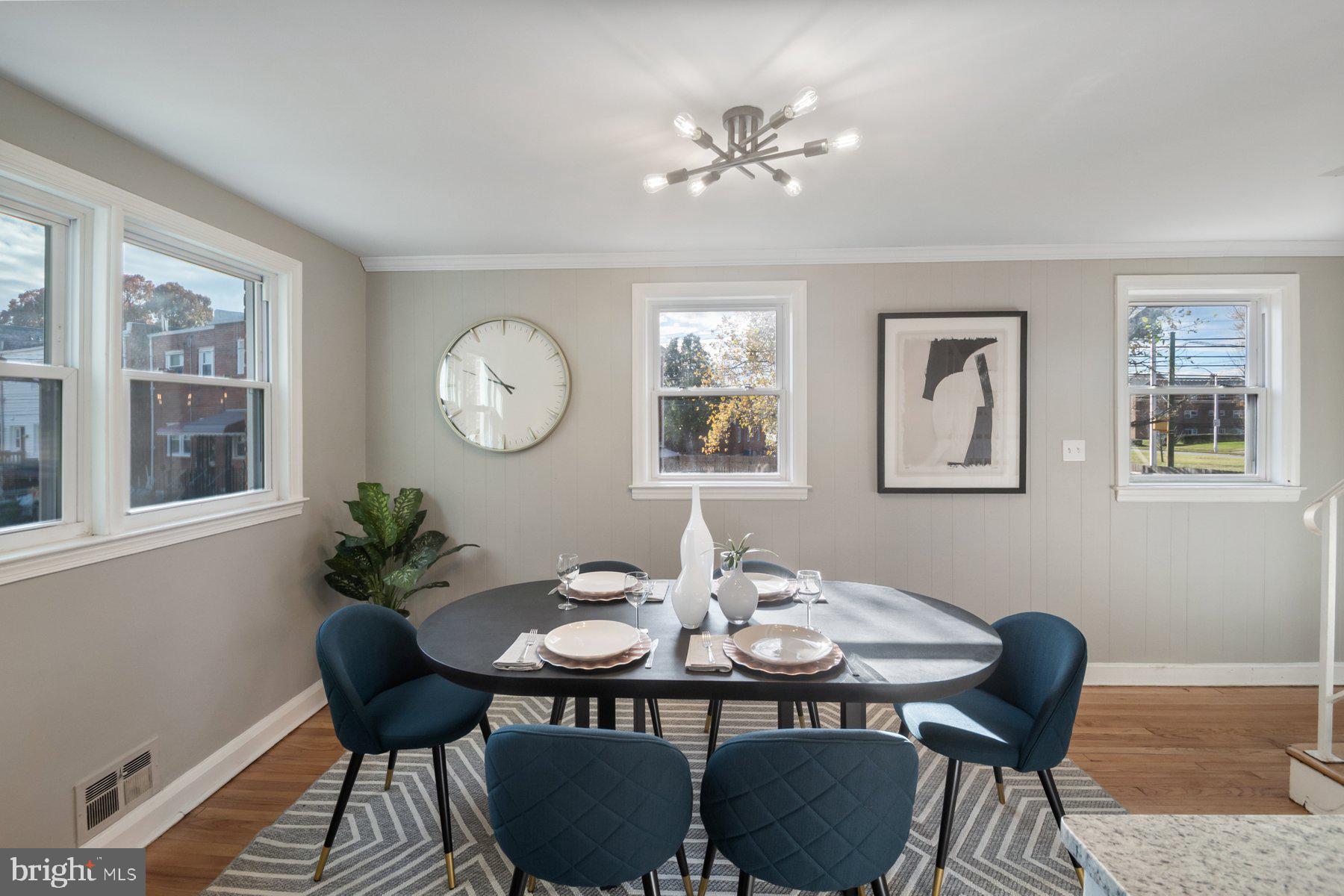 4801 Sinclair Lane Baltimore, MD 21206 - Photo 8 of 28 a view of a dining room with furniture and chandelier