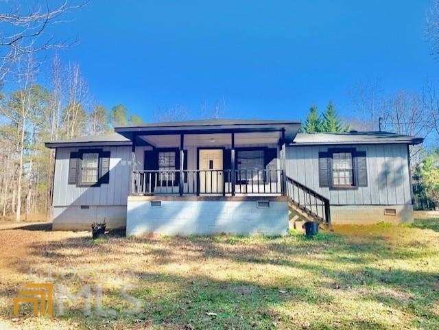 49 Stella Wynn Road Newnan, GA 30263 - Photo 1 of 1 a view of a house with pool and sitting area
