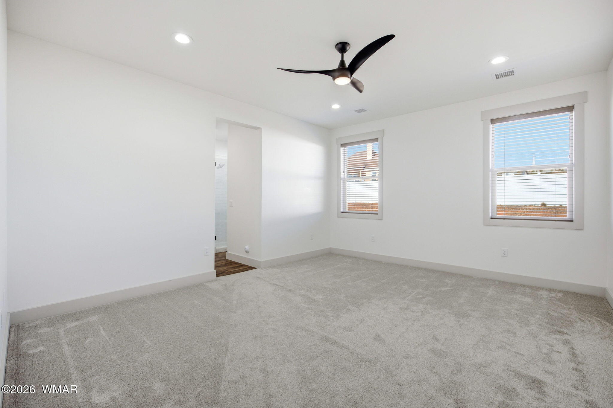 1852 West 7th S Street Snowflake, AZ 85937 - Photo 12 of 37 an empty room with windows and fan