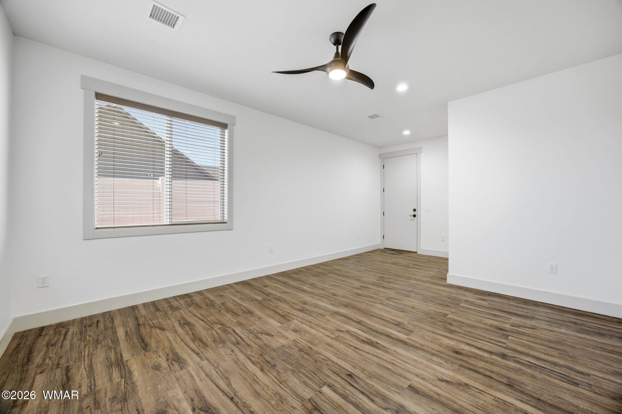 1852 West 7th S Street Snowflake, AZ 85937 - Photo 17 of 37 a view of empty room with wooden floor and fan