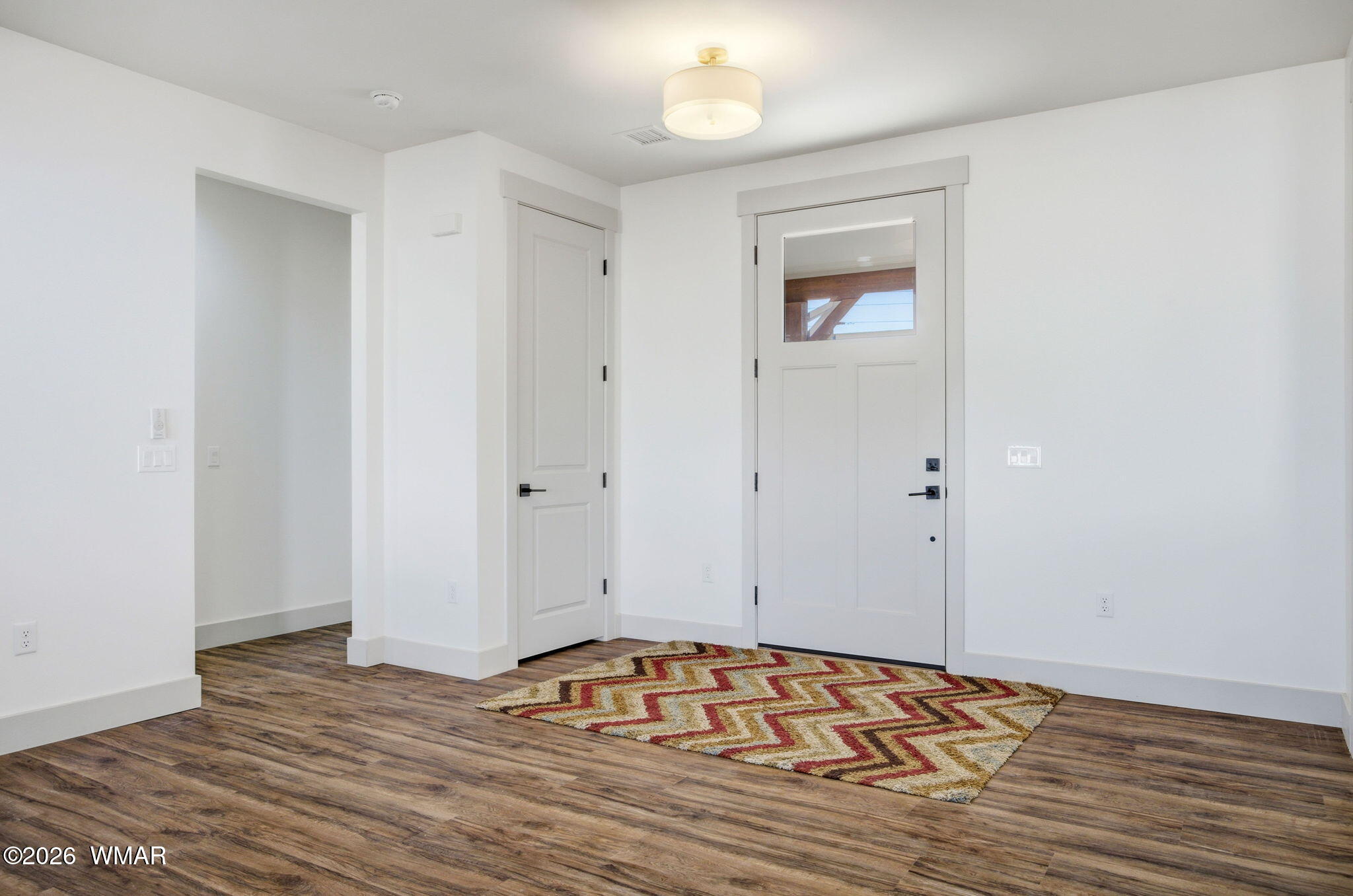 1852 West 7th S Street Snowflake, AZ 85937 - Photo 5 of 37 a view of empty room with wooden floor and fan