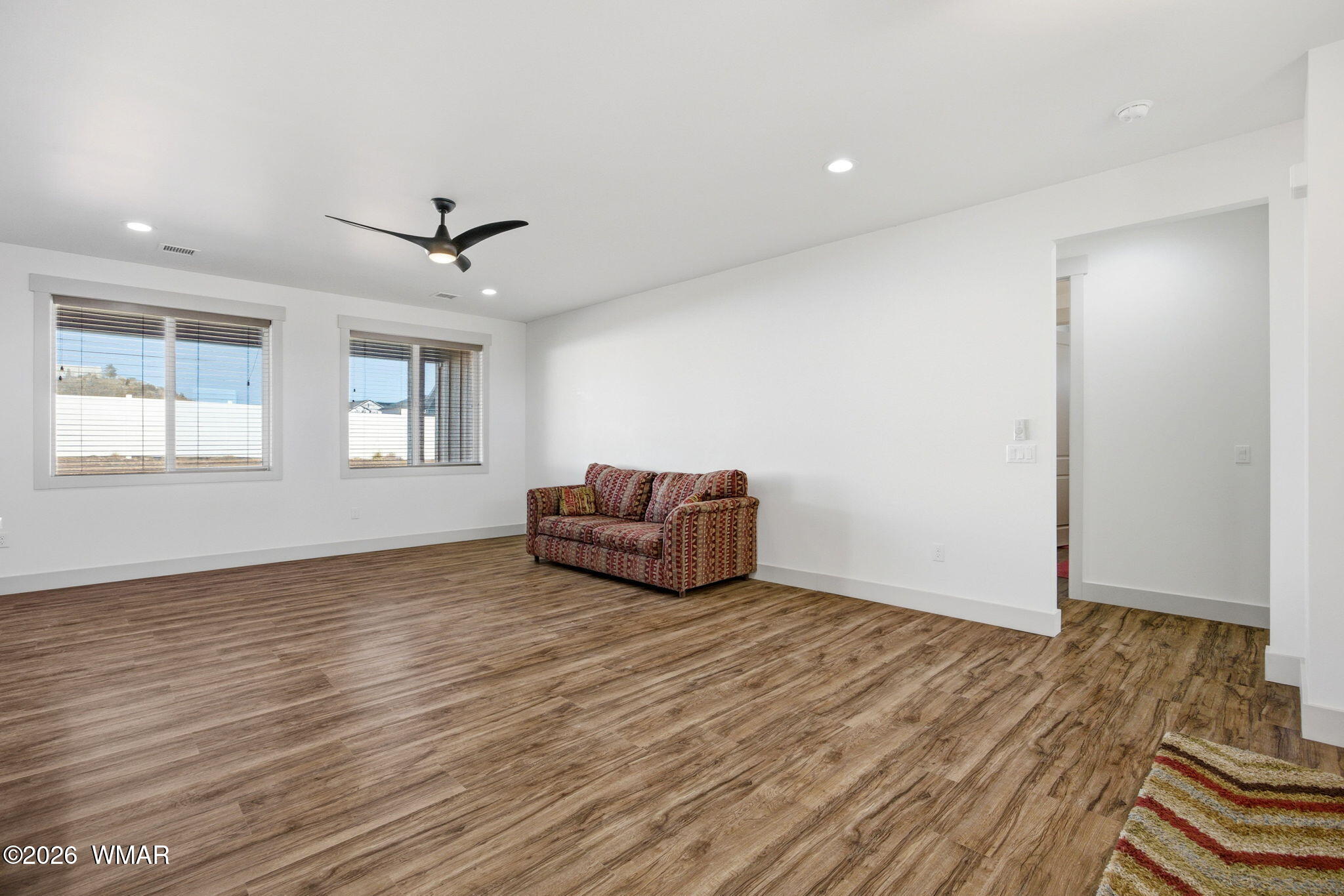 1852 West 7th S Street Snowflake, AZ 85937 - Photo 6 of 37 a view of an empty room with wooden floor and a window
