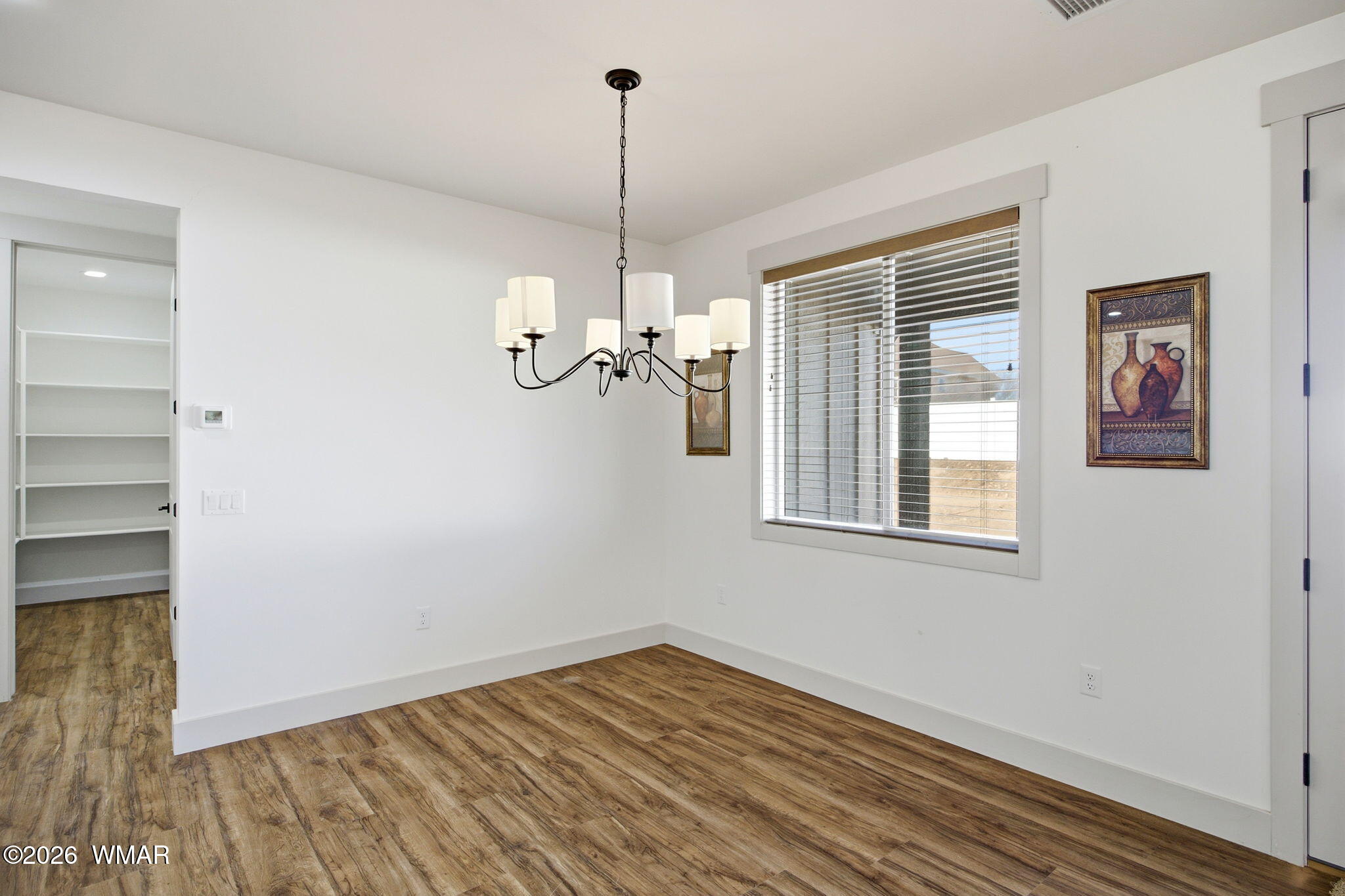 1852 West 7th S Street Snowflake, AZ 85937 - Photo 8 of 37 a view of empty room with wooden floor and fan