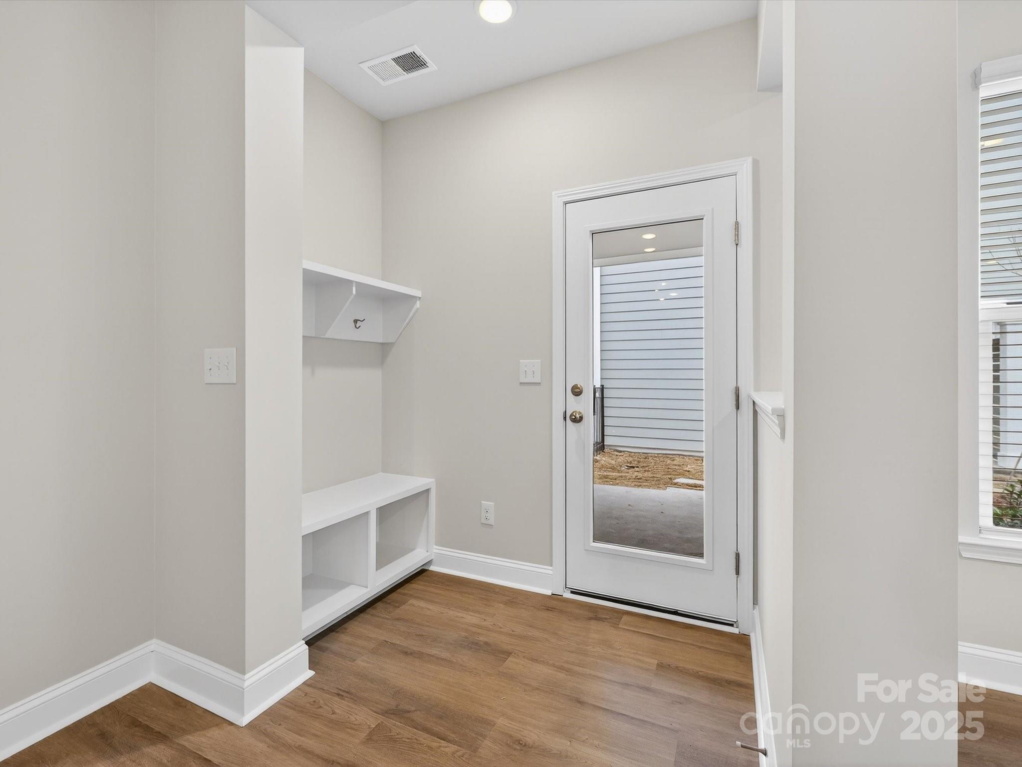11445 Prosperity Church Road Huntersville, NC 28078 - Photo 15 of 35 a view of an empty room and wooden floor