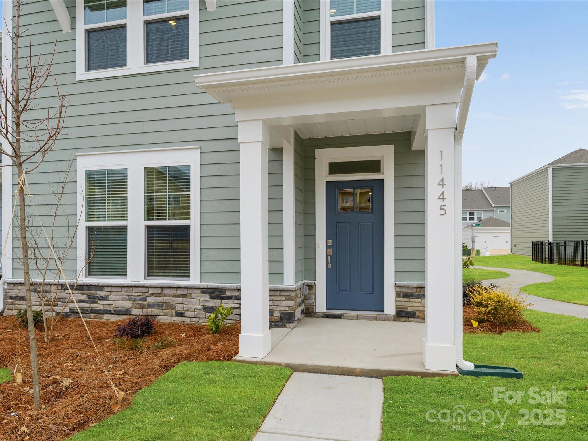 11445 Prosperity Church Road Huntersville, NC 28078 - Photo 2 of 35 a front view of a house with garden