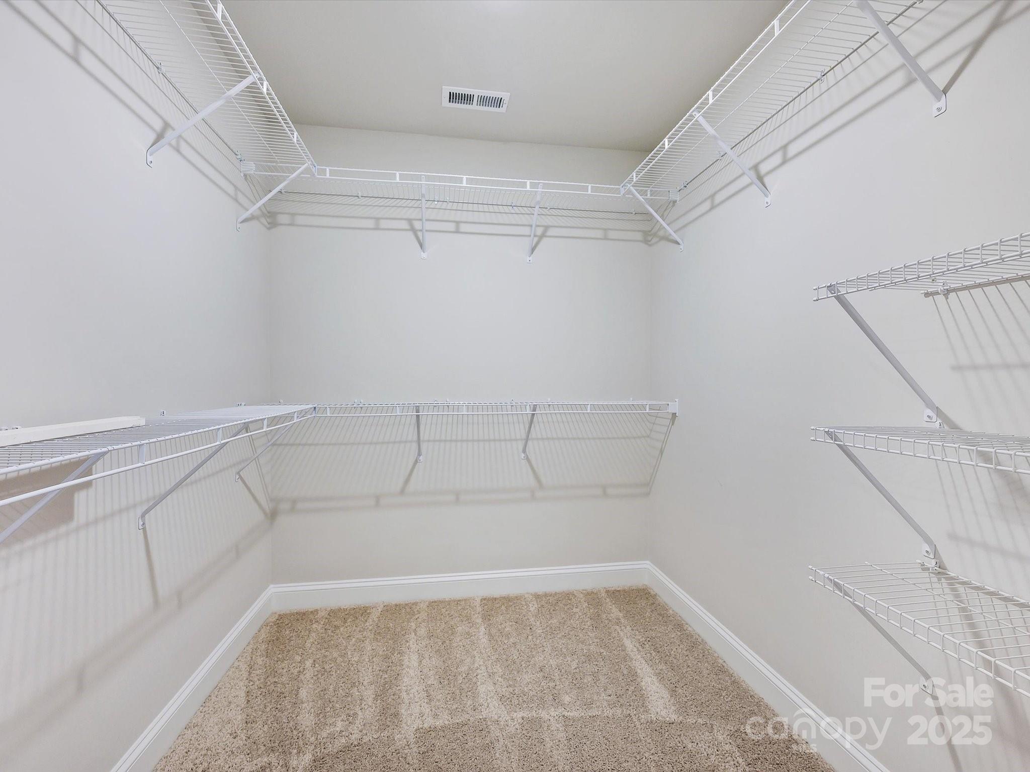 11445 Prosperity Church Road Huntersville, NC 28078 - Photo 21 of 35 a view of a room with racks on the wall