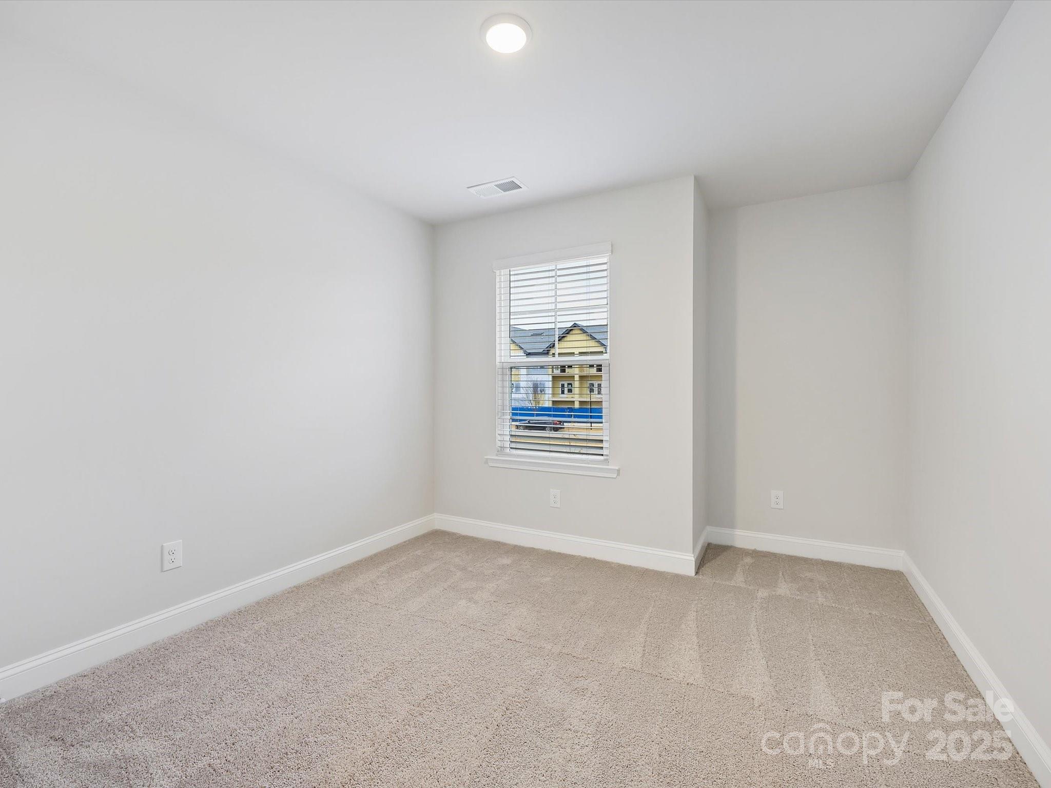 11445 Prosperity Church Road Huntersville, NC 28078 - Photo 22 of 35 an empty room with windows