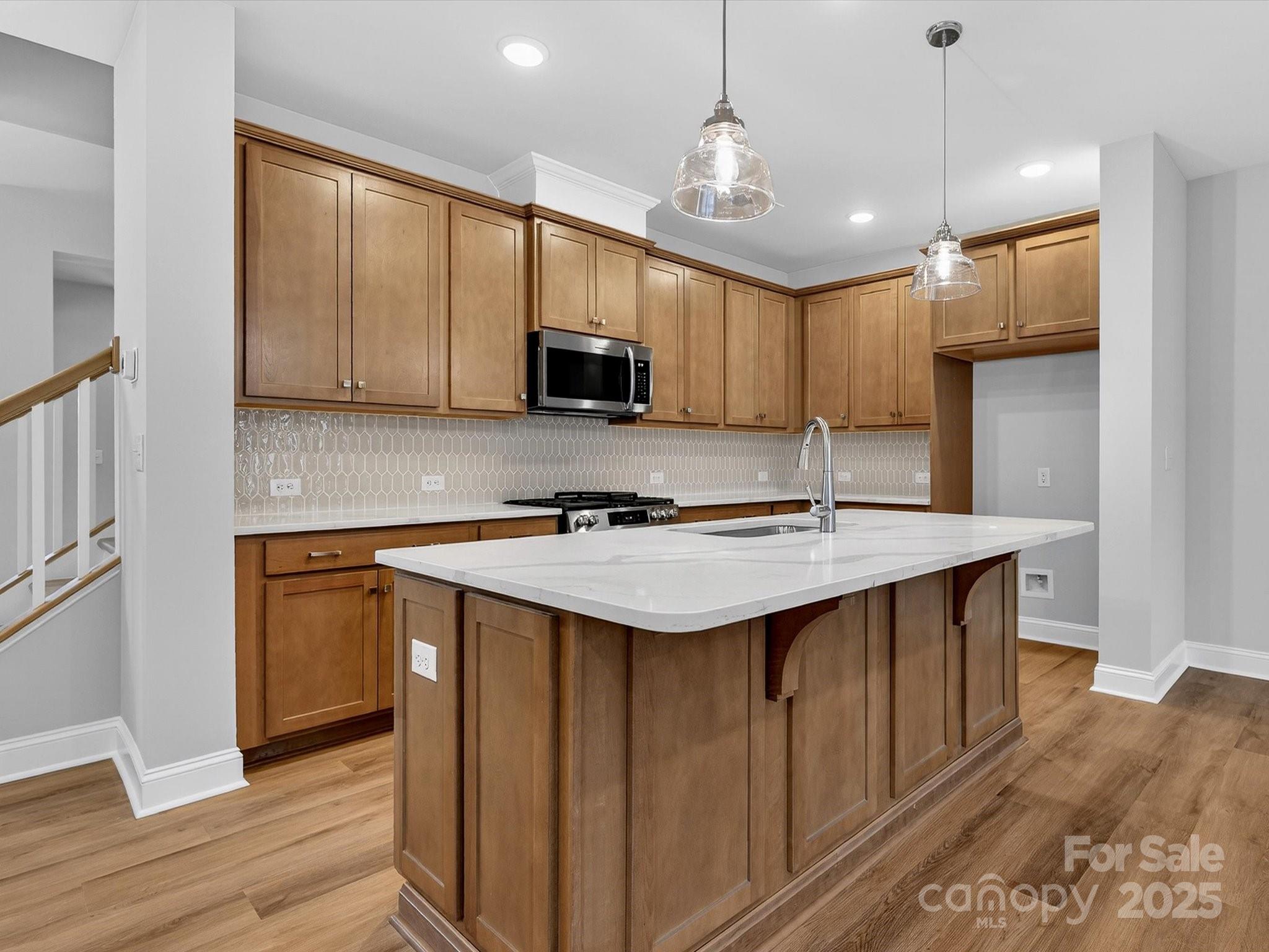 11445 Prosperity Church Road Huntersville, NC 28078 - Photo 7 of 35 a kitchen with stainless steel appliances granite countertop a sink stove and refrigerator