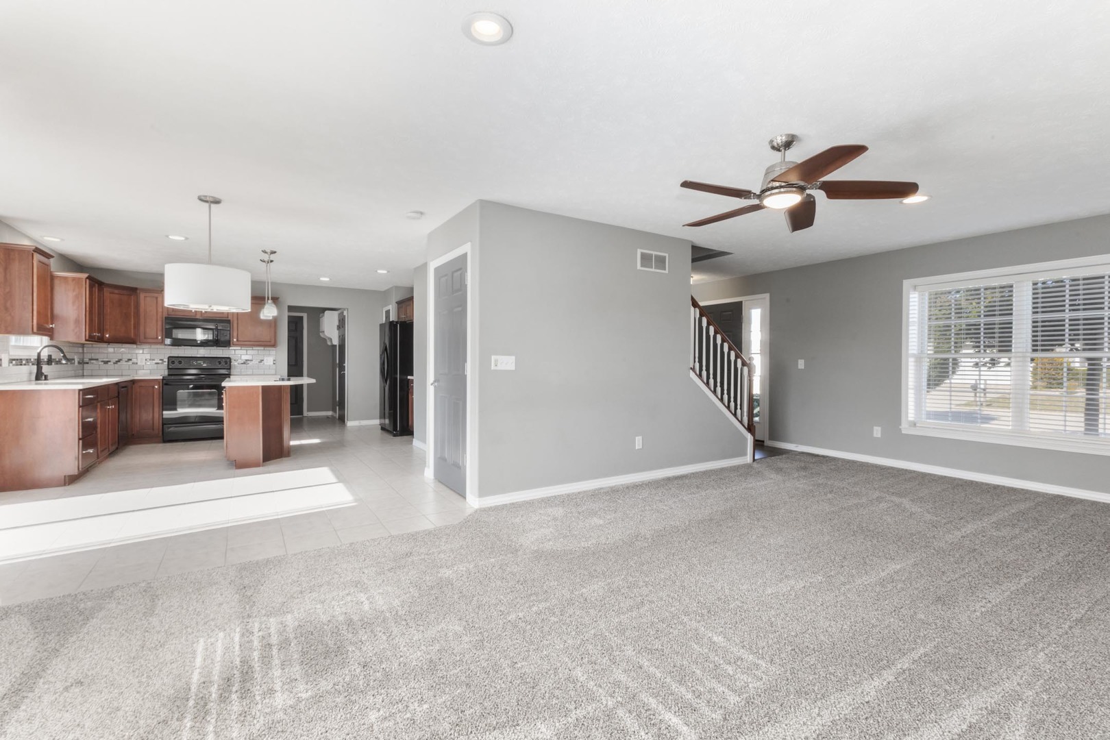 3291 Marimarsh Lane Normal, IL 61761 - Photo 21 of 55 a view of a kitchen with a sink and a refrigerator