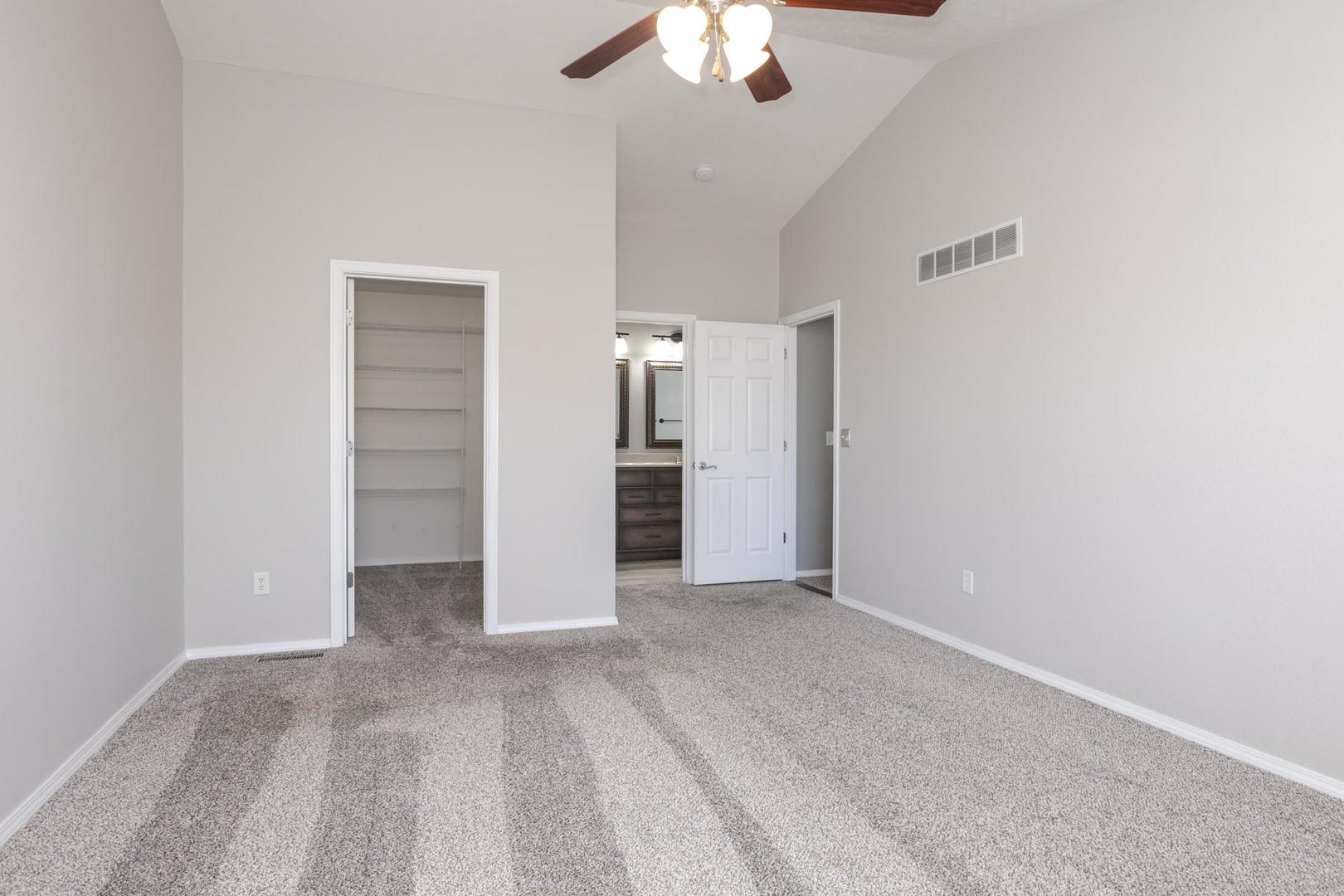 3291 Marimarsh Lane Normal, IL 61761 - Photo 32 of 55 an empty room with a chandelier fan and closet