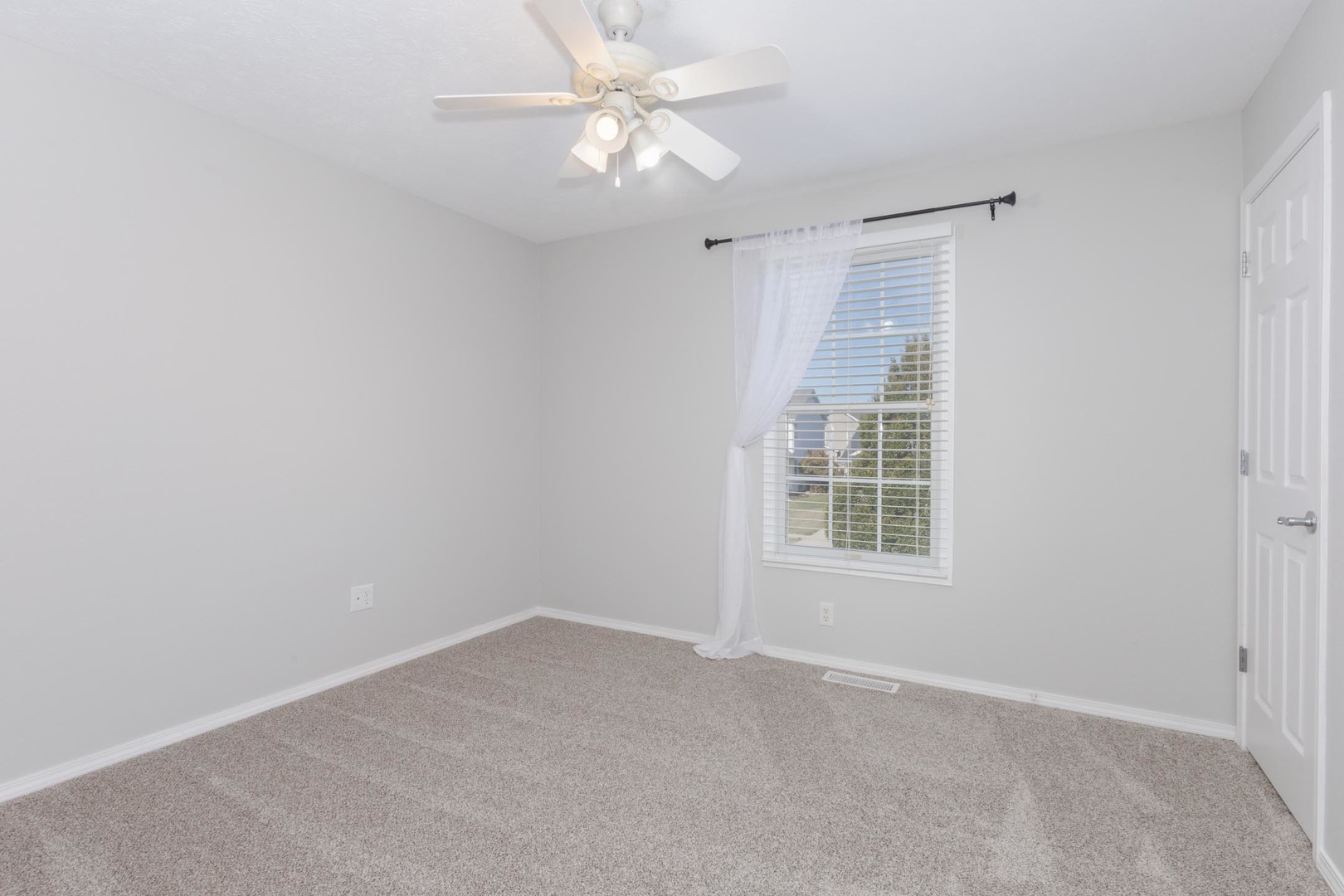 3291 Marimarsh Lane Normal, IL 61761 - Photo 34 of 55 an empty room with a window and a fan