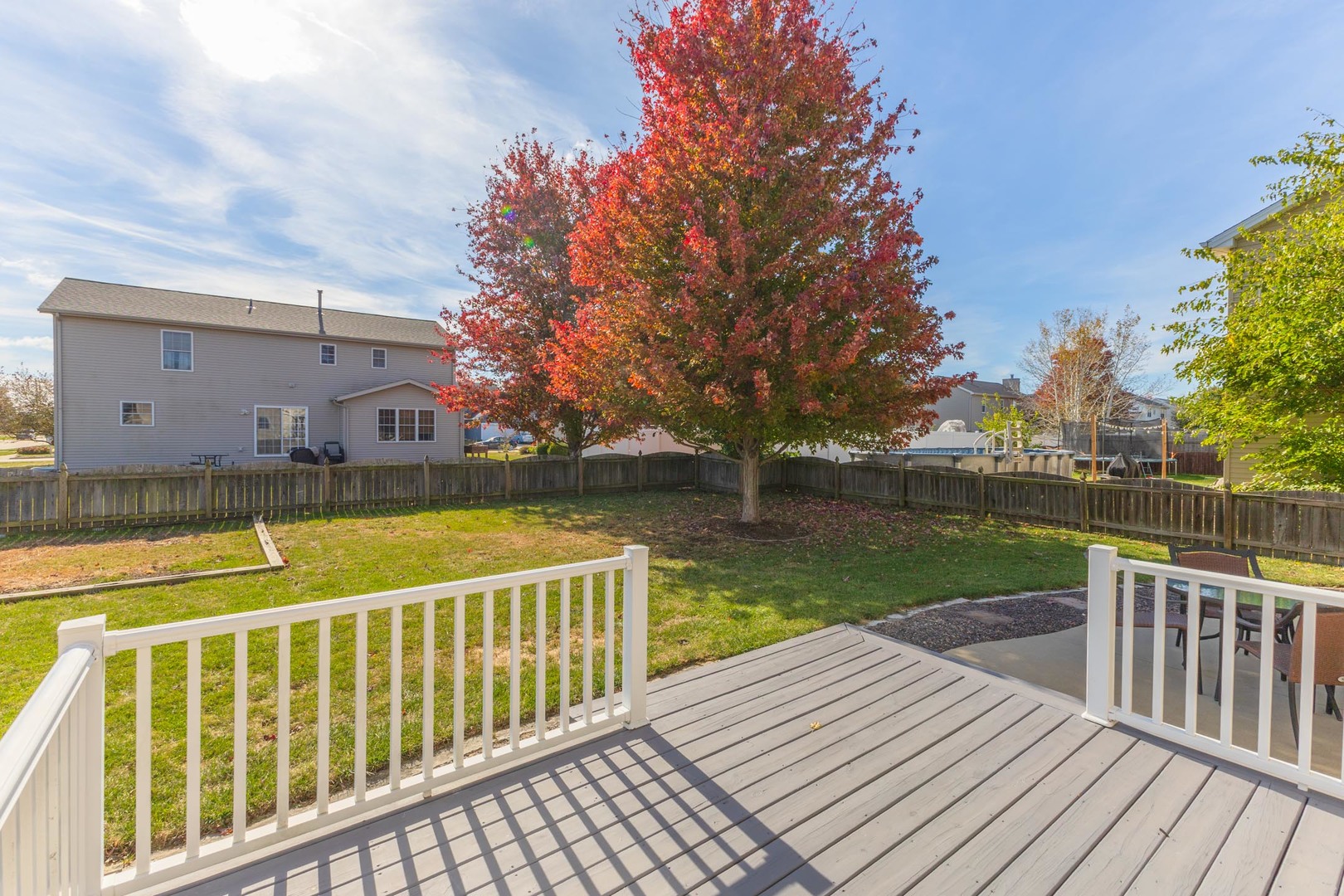 3291 Marimarsh Lane Normal, IL 61761 - Photo 45 of 55 a view of a wooden deck with a lake view