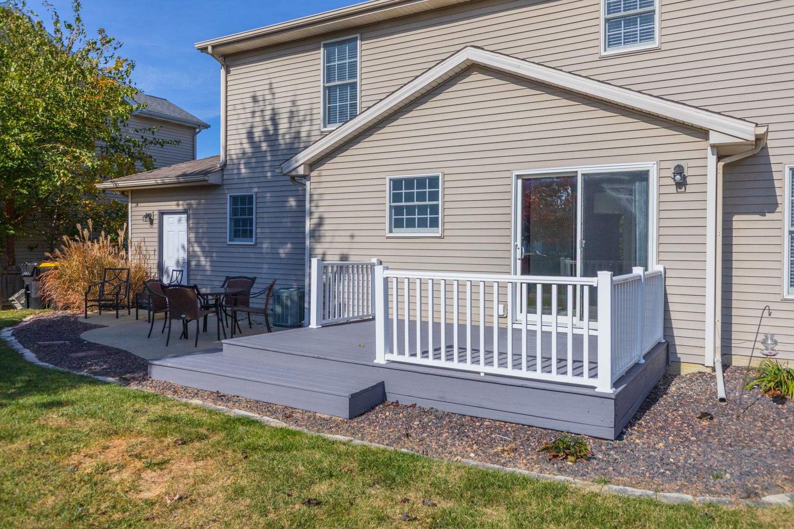 3291 Marimarsh Lane Normal, IL 61761 - Photo 50 of 55 a view of a house with a yard and a garden
