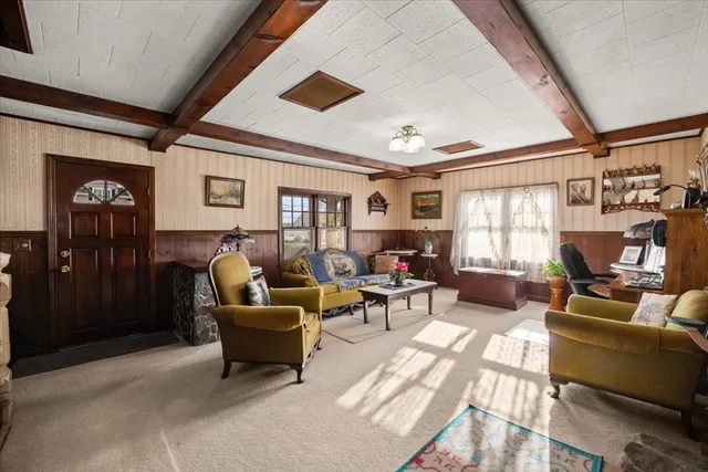 a bedroom with furniture and a window