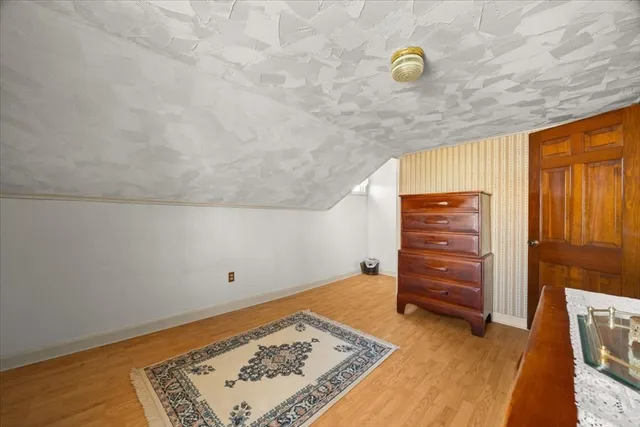 a room with furniture and a dresser