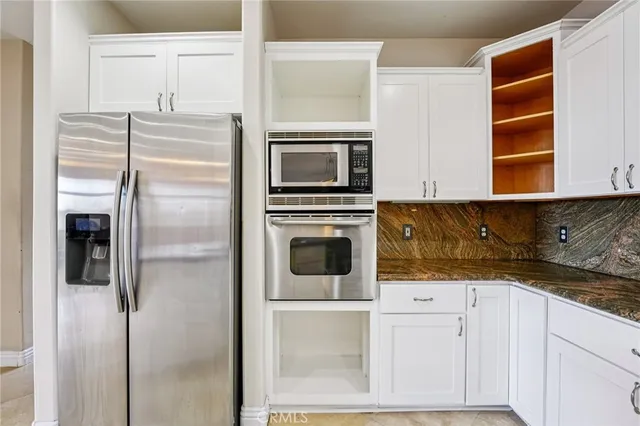 a kitchen with sink and cabinets