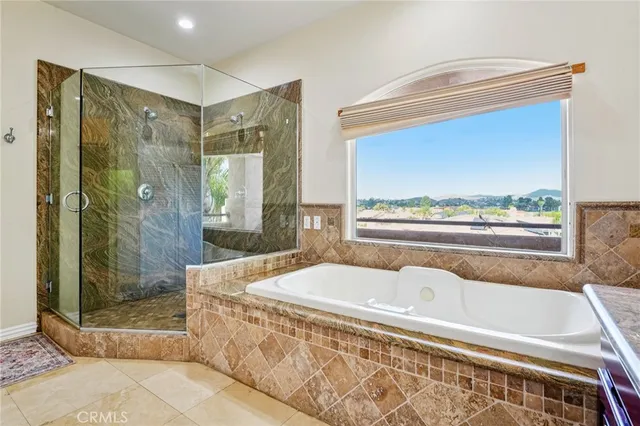 a bathroom with a glass shower door